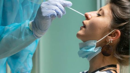 Healthcare professional performing a nasal swab test