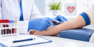 Lab technician preparing a blood sample for a cholesterol test